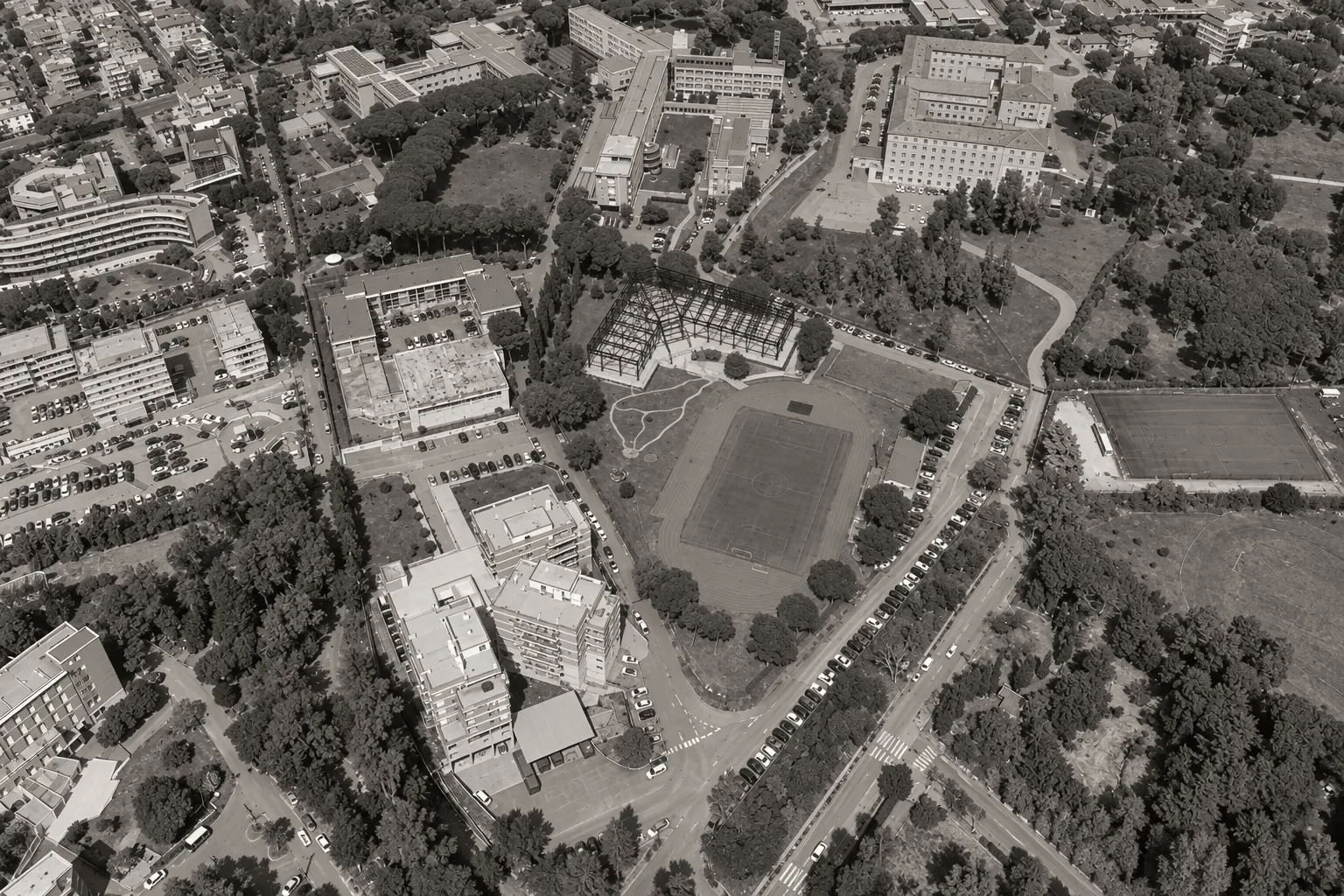 Aerial view of the site with the new classroom and laboratory building, derived from the design site plan